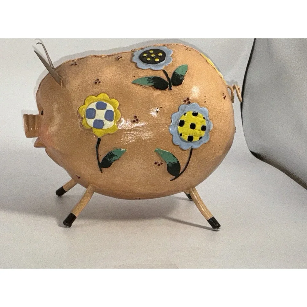 Floral Decorated Pig With Curly Tail And Cute Ears Made Of Metal?